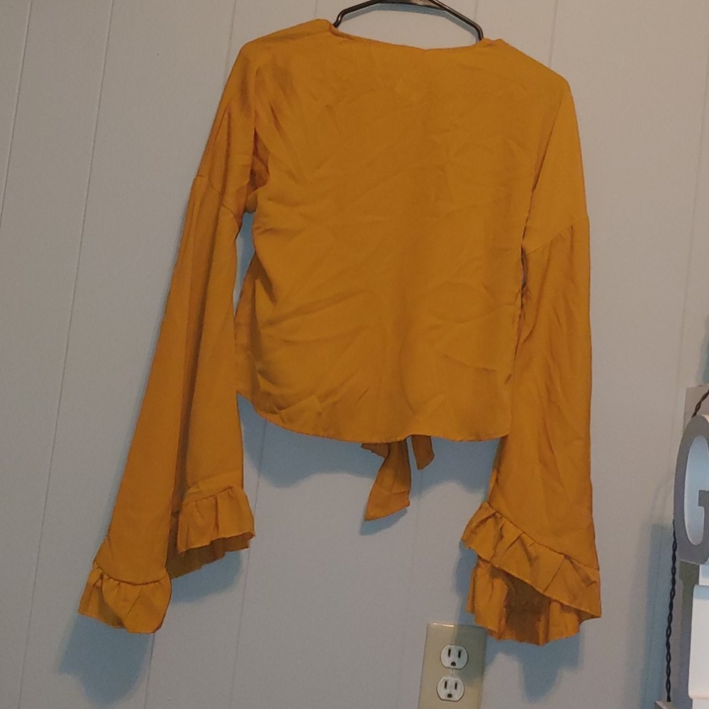 Bell sleeve open back blouse